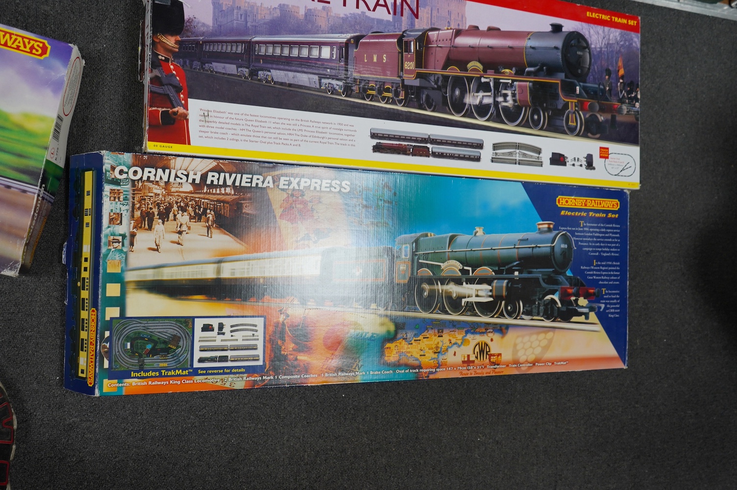 Three Hornby 00 gauge railway boxed train sets; The Royal Train (R1057), the Cornish Riviera Express (R826) and The Caledonian (R775), each comprising of a tender locomotive, three coaches, track sections, controllers, e